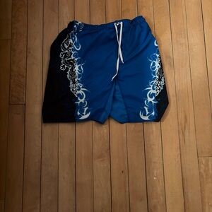 Black and blue dragon design surf trunks